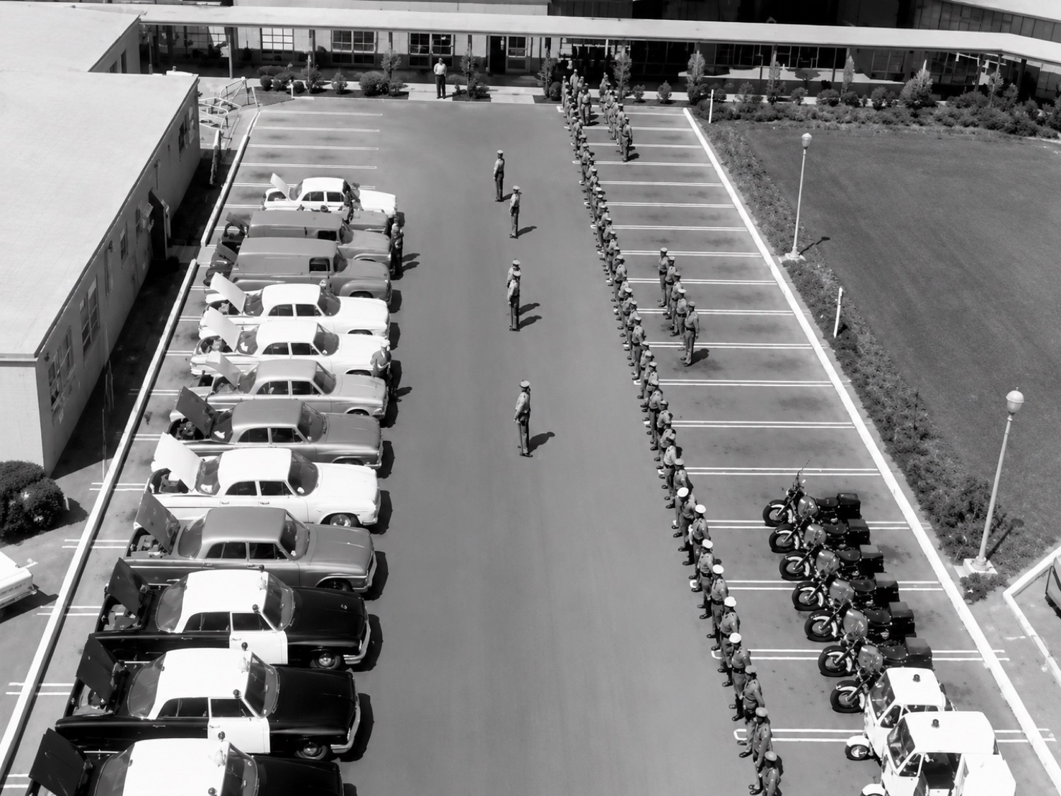 Newport Beach Police Department vehicles and officers at the station